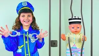 Milana play a policeman with a baby doll