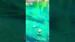 Blausee lake statue of girl that drowned 😅 #travel #nature #wonderfulswiss #swissalps #blauseelake