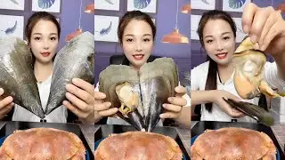 The cute girl eat mussel of seafood # 163