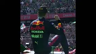 Max Verstappen gets lifted onto the podium...