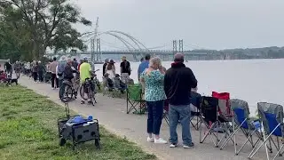 People gather for the demolition of the old I-74 bridge