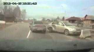 Car Crashes into Roadblock and Car