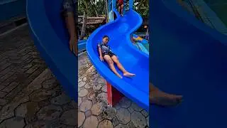 Fais playing on the slide