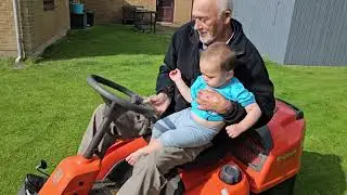 Gran Pa and Simon  cutting the lawn