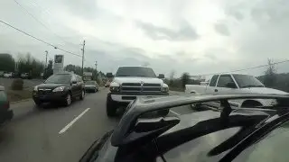 Nissan GTR speeding through traffic with 2 Diesel Trucks