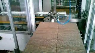 Автоматическая укладка пакетов с молоком в гофроящик