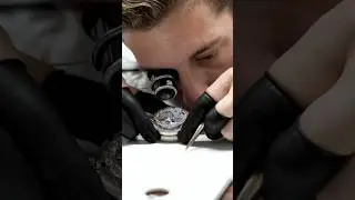 IWC watchmaker, shows the assembly process of the Portugieser Perpetual Calendar 44. 📷 IW503703