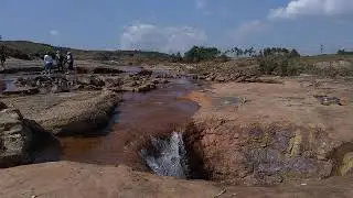 Rocky Stream Landscape with Travelers | Free 4K Stock Footage for Creators