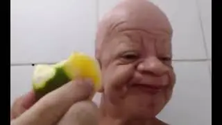 Bald wrinkly man eating fruit