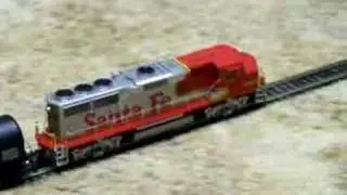 HO scale Santa Fe GP60M pulls a train! Never seen before!