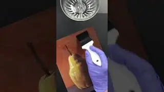 Varnishing an Oil Painting of a Pear
