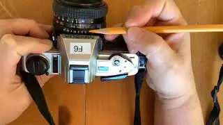 Parts of a Vivitar and Minolta film camera