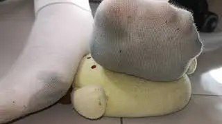 Dirty socks playing with dolls