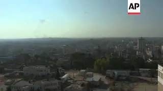 Smoke plumes on Gaza skyline, as Hamas rockets threaten Israel's unilateral truce