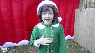 The Assistant and Ryan Help Little Buddy Elf Teach the Grinch