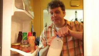 A Man Making A Romantic Dinner Needs Reading Glasses
