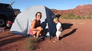 Pounding the tent stakes in Moab