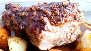 Roasted turkey thigh in Asian style sauce with potatoes and sweet potato in the oven