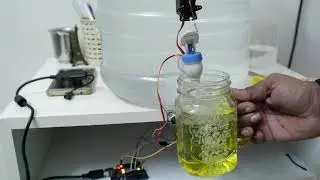 Automatic water dispenser using ultrasonic sensor.