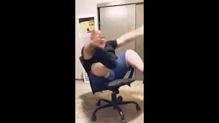 Fat guy nearly falling out of chair