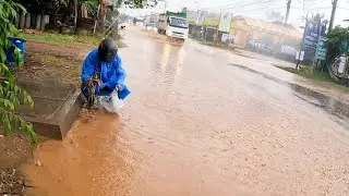 Unclogging Clogged Culvert Drain, Draining a Flooded Street Heavy Rain