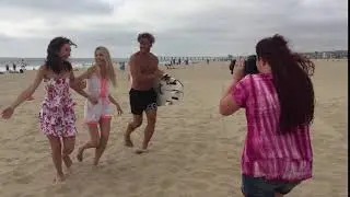 behind the scenes of a Photo shoot in hermosa beach California on the boardwalk