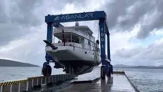 YACHT being lifted out of water for maintenance