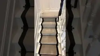 Vintage white windsor velvet, black cotton border, wrought iron stair rods.