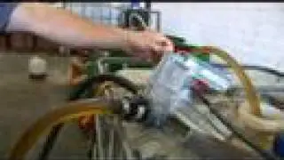 Hippy Gourmet at VegRev converting Vegetable oil to fuel!