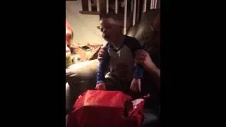 Xander open xmas present.