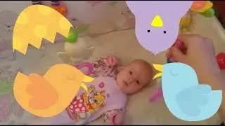 Our girl in the crib looks at the birds