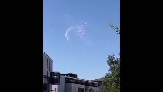 the view of the moon getting hit by an asteroid from earth