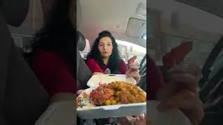 Pedal pumping in Jeff Bains open toe zip platform red black heels eating Indian street food