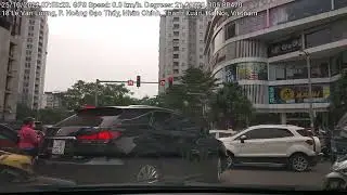 Transport in Hanoi Vietnam - passing a cross road with traffic lamp