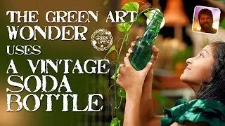THE GREEN ART  WONDER USES A VINTAGE SODA BOTTLE