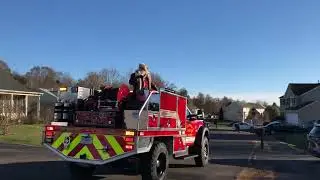 Santa Claus (on the back of a firetruck) drove past us today as we were walking the dog.