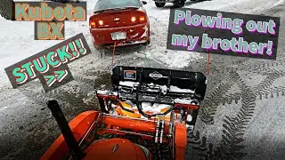 Kubota BX- Plowing out my brother + Pulling out a stuck vehicle!! (January Snow Storm)
