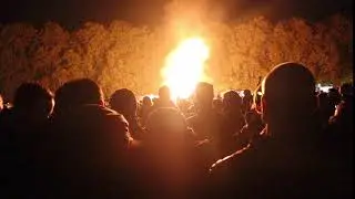 Huge crowd watching a fire burning - royalty free christmas scene stock footage - bonfire video