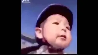 Asian kid falls of bike meme 