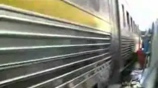 Train Runs Through Bangkok Market