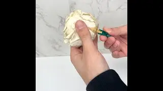 Attaching a stem extender from Petal+Eon to a preserved rose to attach into Eon Grass or floral foam