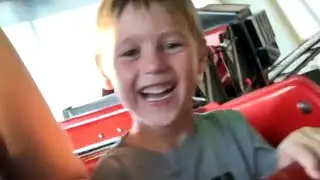 Excited little boy rides train rollercoaster fearlessly during family vacation || WooGlobe