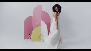 Woman in a white dress dancing.