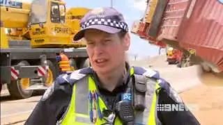 A truck driver has amazingly walked away unscathed from a horrifying crash on the Bolte Bridge.