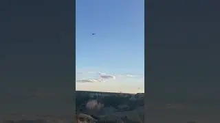Helicopter buzzing Palo Duro Canyon in a hurry.