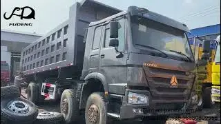 The used 8*4 Howo dump truck is exchanging the brand new tires and doing the lift test.