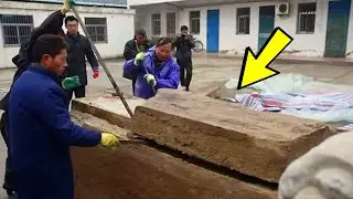 The workers discovered a box underground; when they opened it, they screamed in horror!