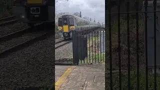 Heathrow express class 387 passes Hanwell at Speed.
