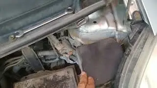 Replacing a light bulb in a Toyota Yaris, drive a disposable dream.