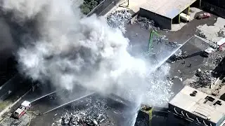 Crews battling large fire at Redwood City metal recycling facility
